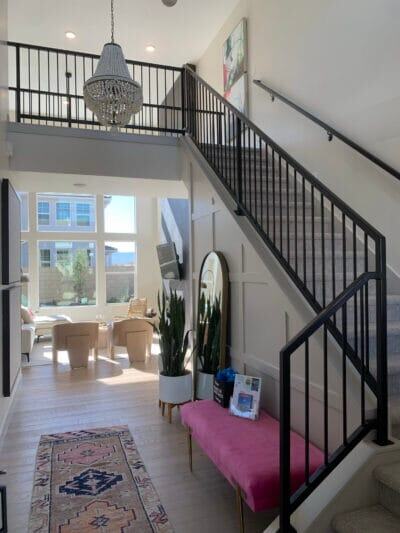 Black steel interior stair railing and second-floor loft guardrail in a St. George home